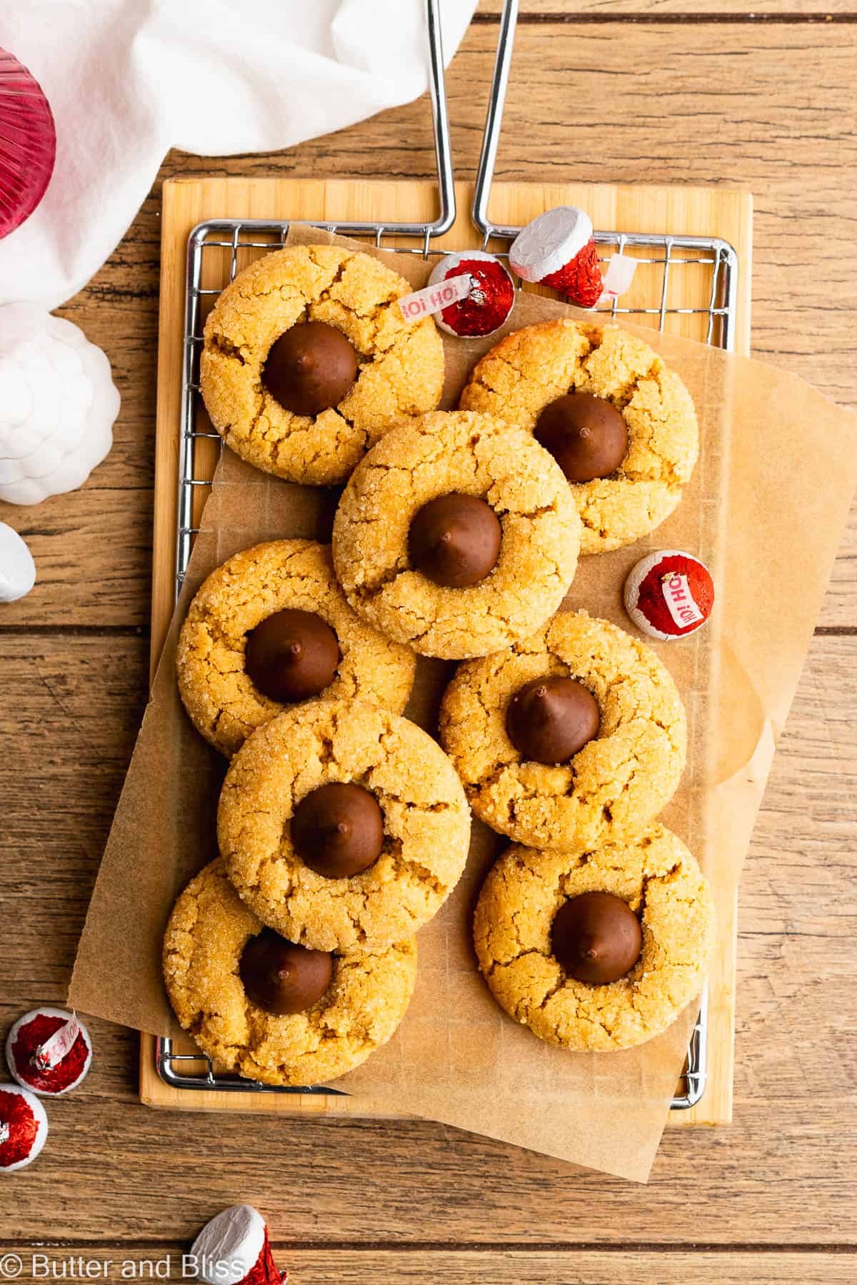 Peanut butter blossom gluten free cookies arranged on a wire rack.