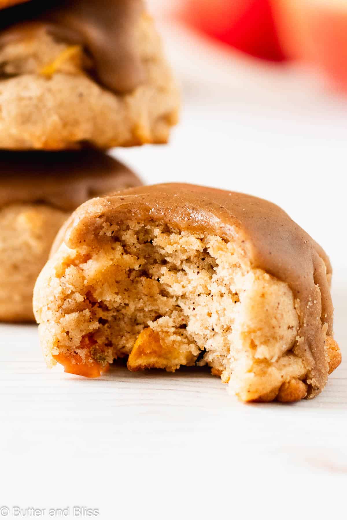 Close up of the soft inside of a fall cookie with caramel icing.