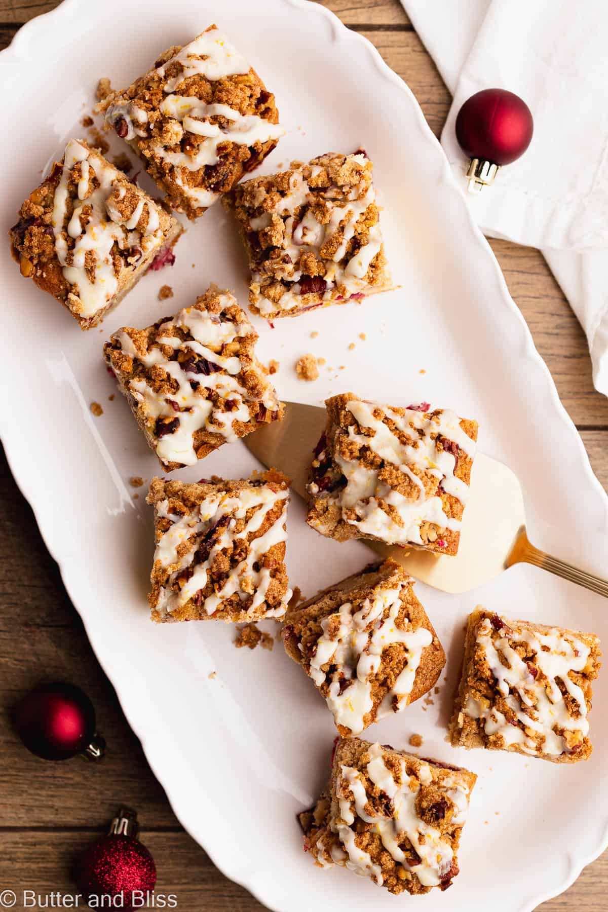 Perfect slices of Christmas coffee cake on a pretty white platter.