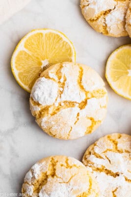 Gluten free lemon crinkle close up with crackly exterior dusted with powdered sugar.