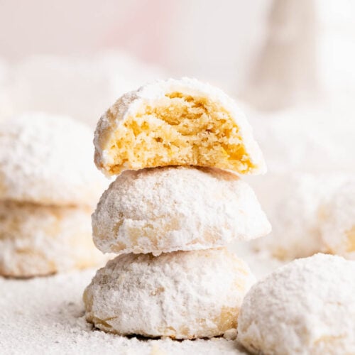 Buttery and soft inside of a gluten free lemon snowball cookie.