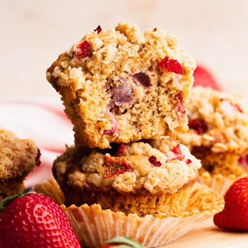 Moist inside of a gluten free strawberry muffin dotted with fresh strawberries.