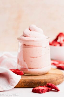 Fluffy strawberry whipped cream piped into a pretty glass jar.