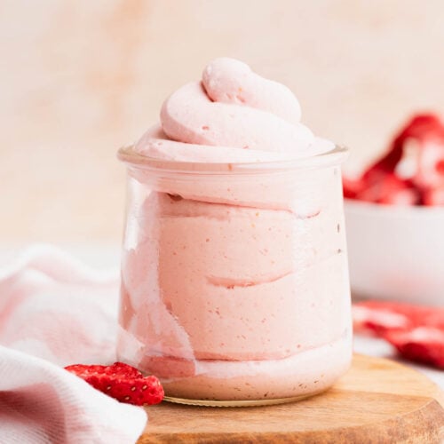 Fluffy strawberry whipped cream piped into a pretty glass jar.