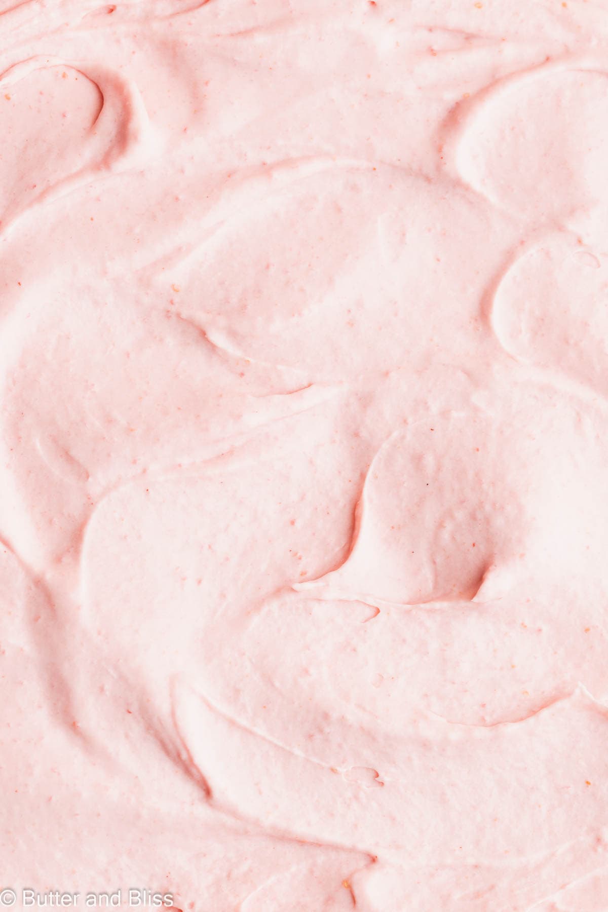Close up of fluffy strawberry whipped cream.