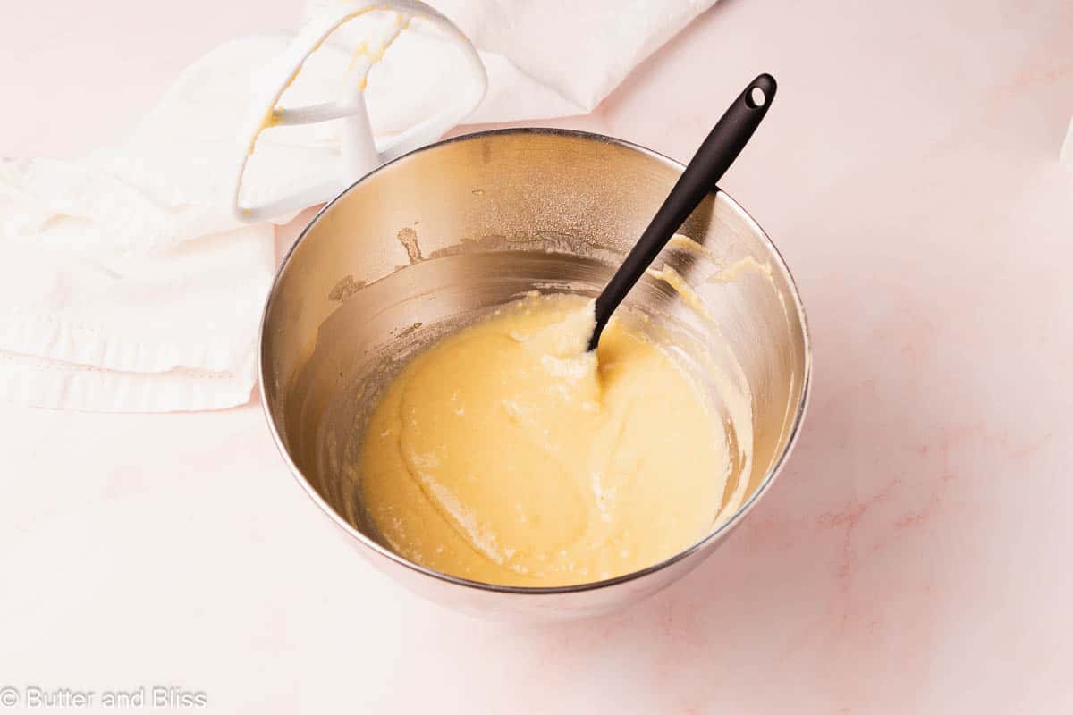 Smooth batter in a mixing bowl with a spatula.