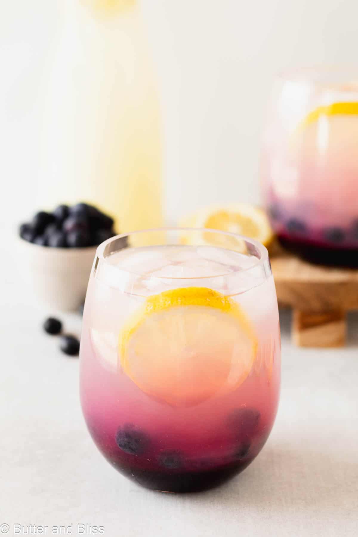 Refreshing homemade summer beverage in a pretty glass on a table.