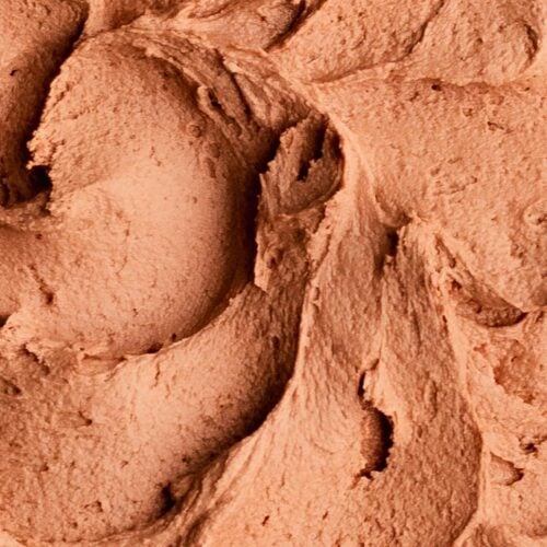 Close up of swirls of creamy peanut butter chocolate buttercream frosting.