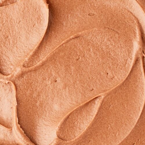 Extreme close up of super creamy chocolate frosting made without butter.