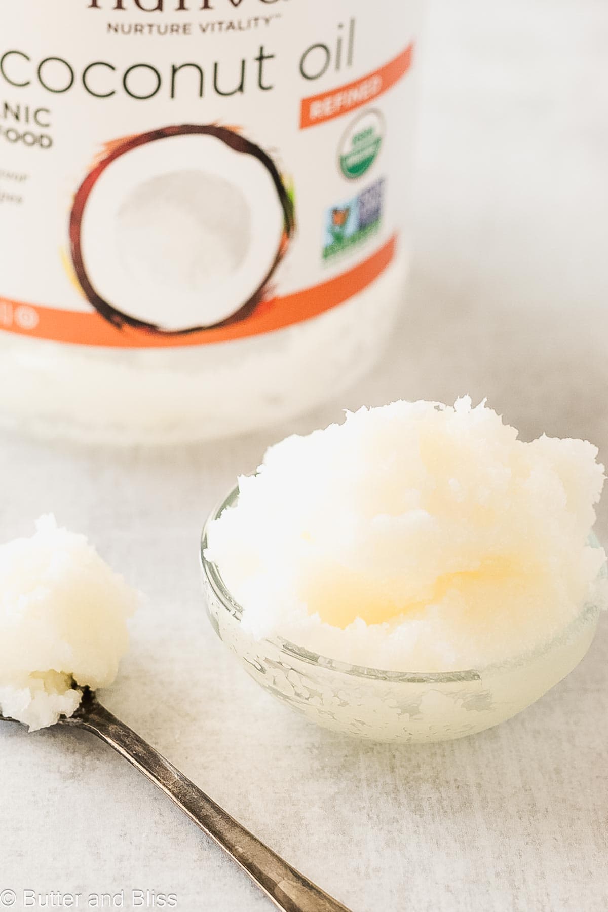 Solid coconut oil in a small bowl.
