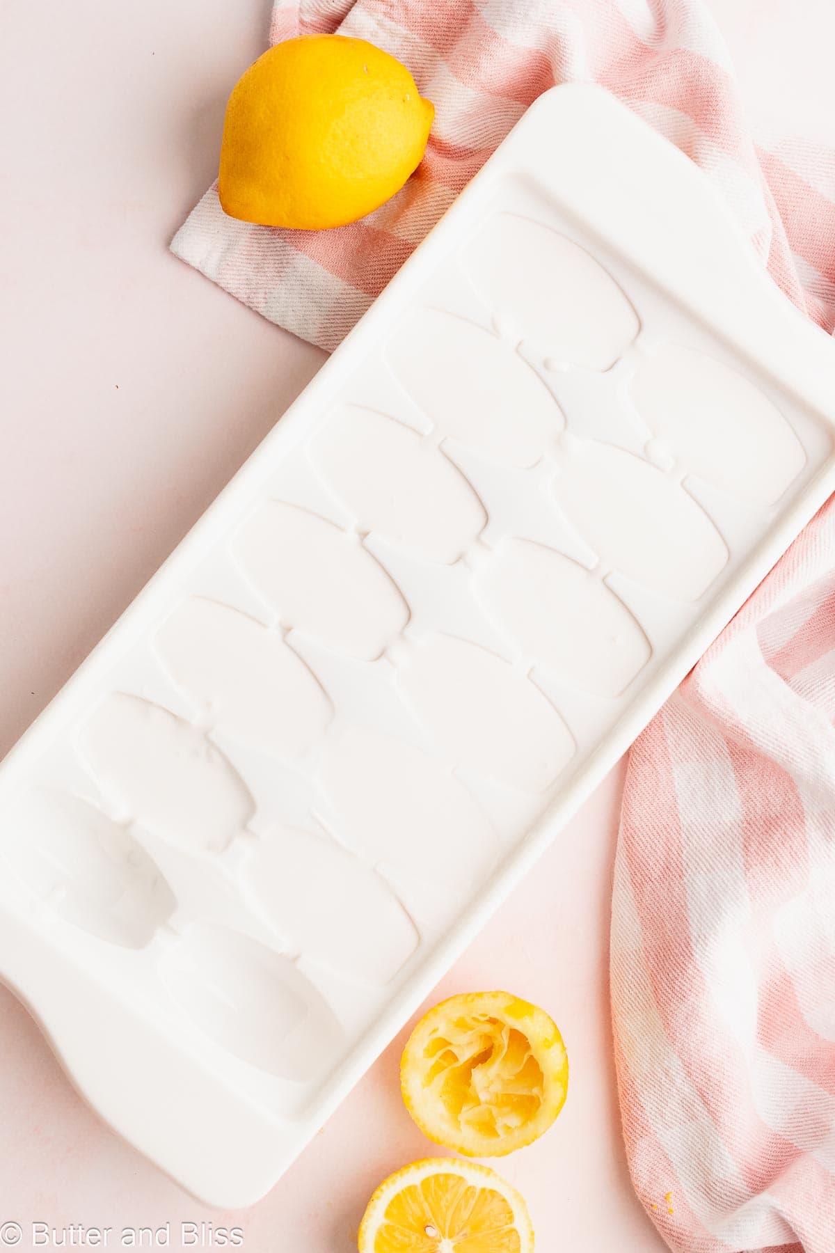 Ice cube tray filled with coconut milk.