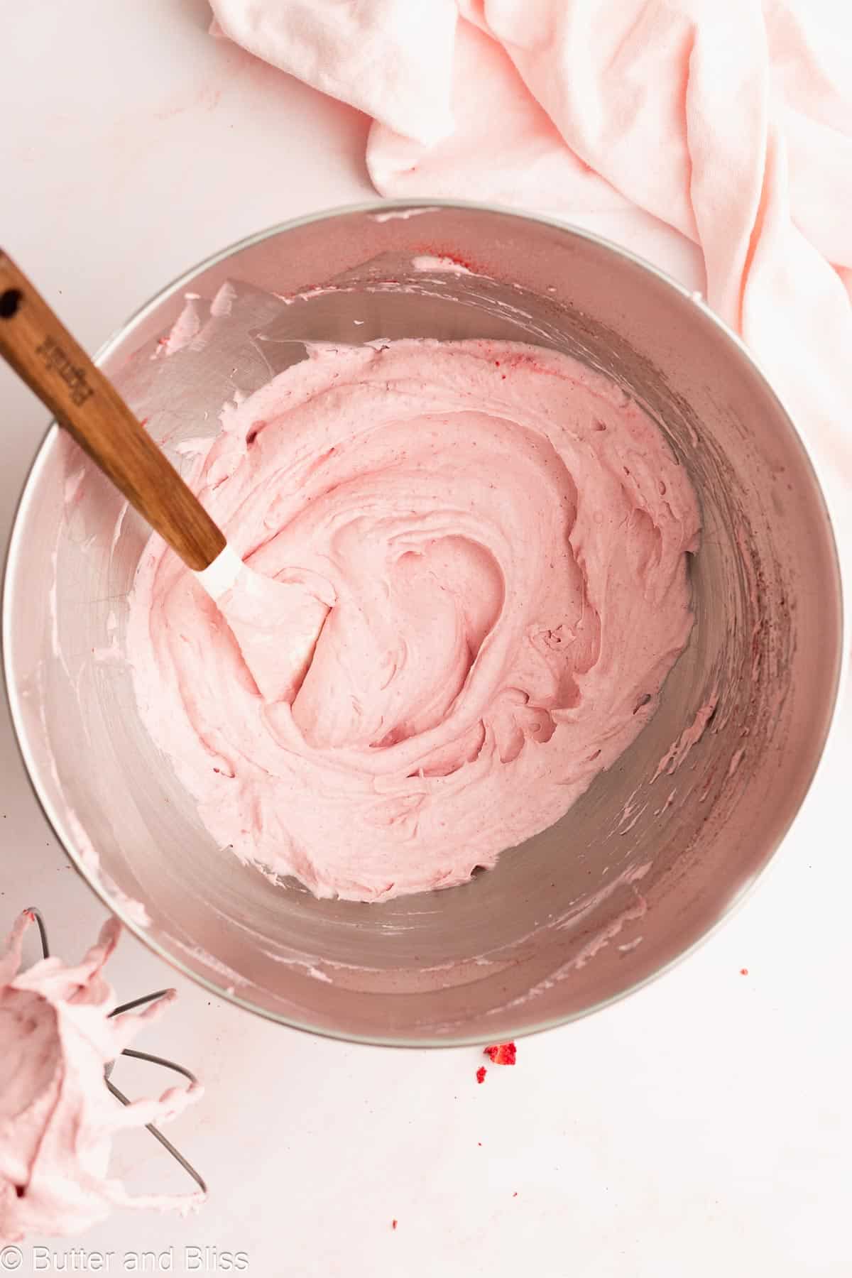 Mixing bowl with dairy free strawberry whipped cream.