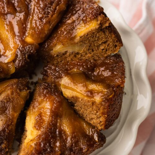 Slices of apple cider mini cake on a cake platter.