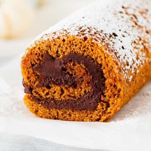 Chocolate filling swirl inside a pumpkin roll cake.