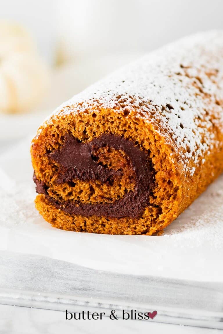 Chocolate filling swirl inside a pumpkin roll cake.