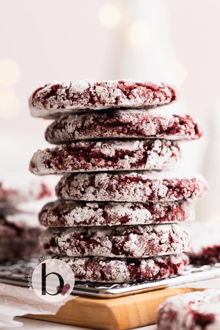 Stack of small batch red velvet cookies on a wood tray.