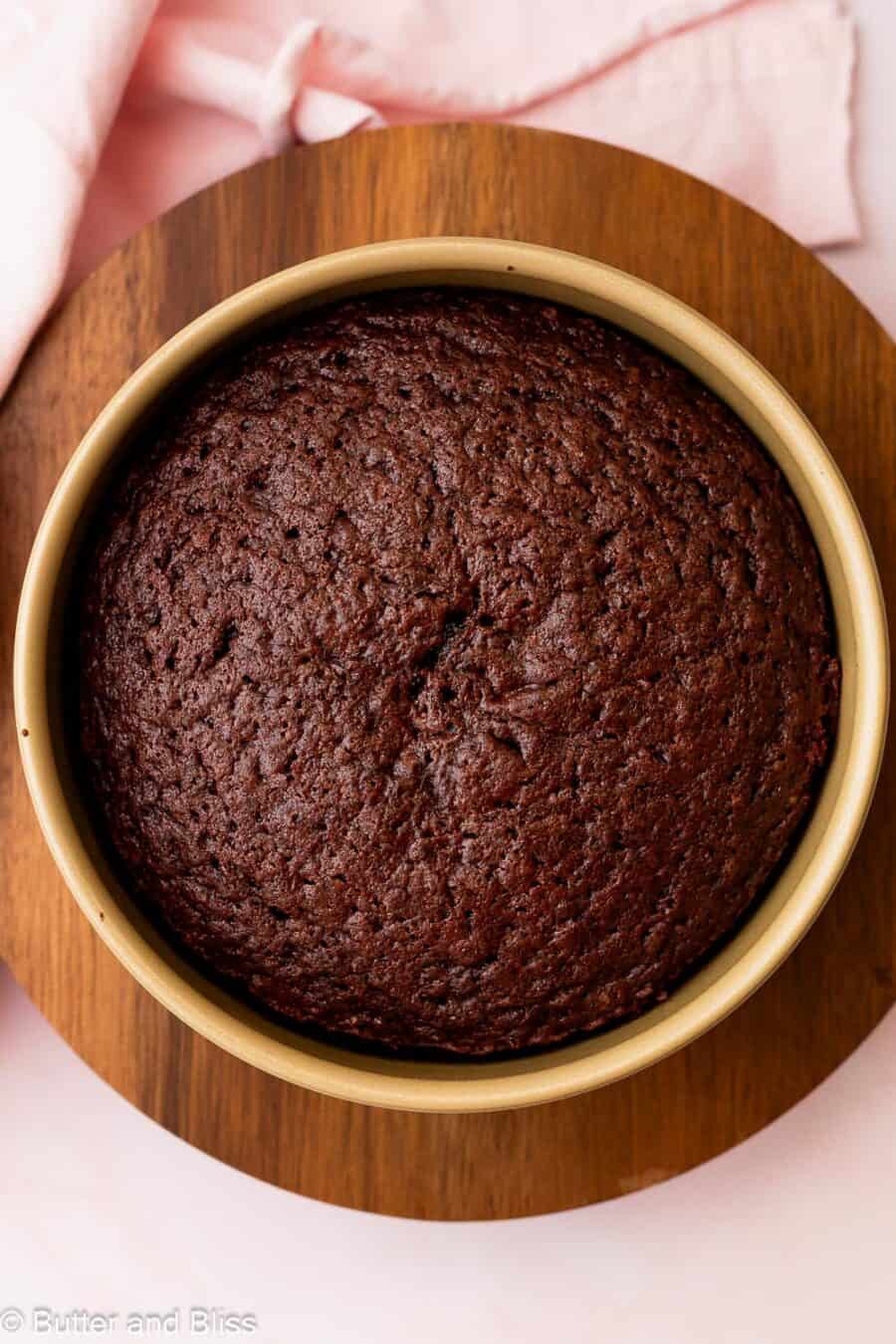 Fresh baked small chocolate cake, cooling in a pan.