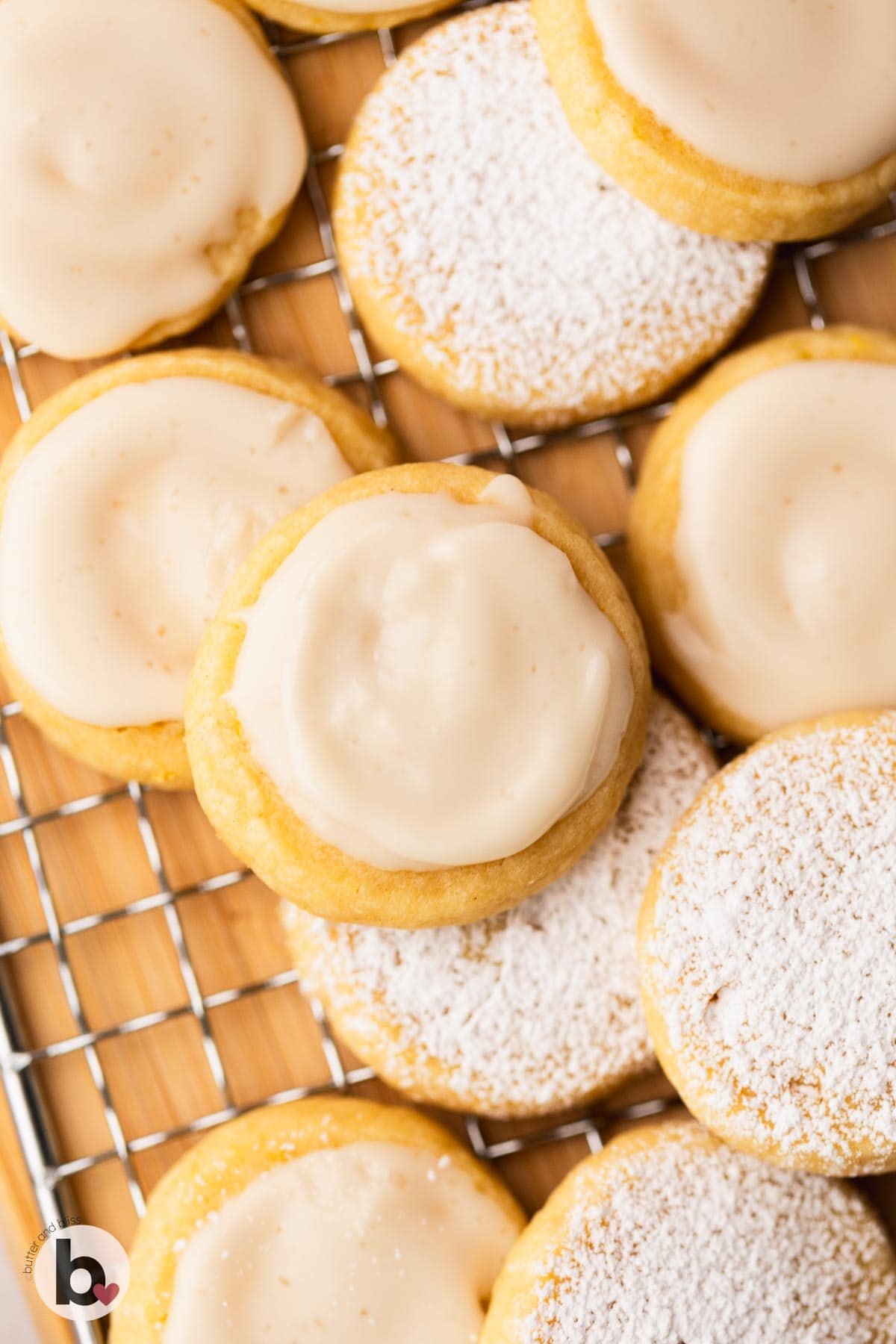 Lemon shortbread cookies on a wire rack and finished with icing and sugar.