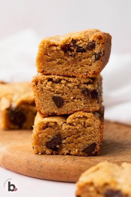 Stack of three blondies made with peanut butter and chocolate chips.