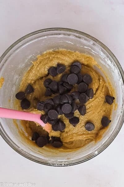 Large chocolate chips added to blondie batter.