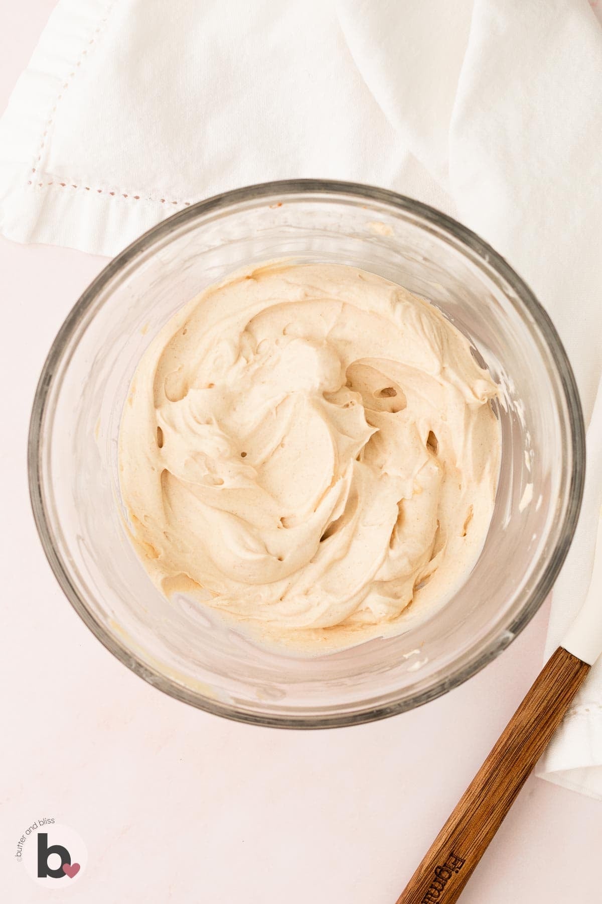 Fluffy maple cinnamon cream cheese frosting in a bowl.