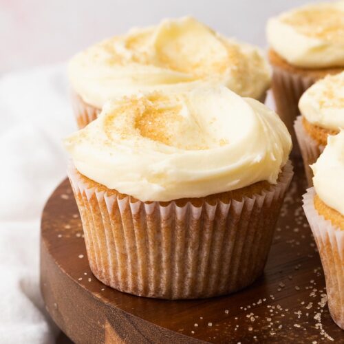 Creamy frosting swirled onto a snickerdoodle cupcake.