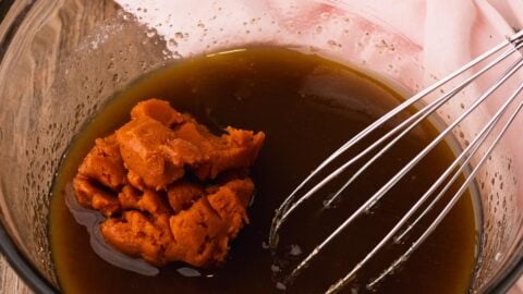 Wet ingredients for pumpkin cookie bars.