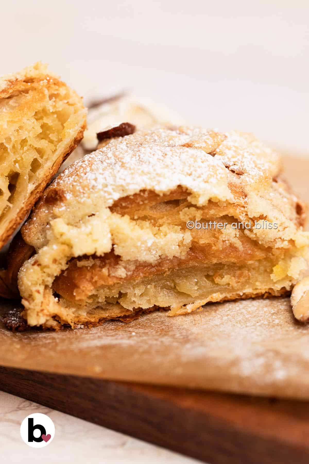 Butter and Bliss croissant cut in half to reveal buttery almond cream filling.