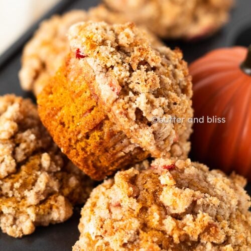 Butter and Bliss small batch apple pumpkin streusel muffins in a muffin tin.
