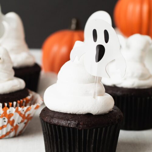 Small batch Halloween chocolate cupcakes decorated with marshmallow ghosts on a table.