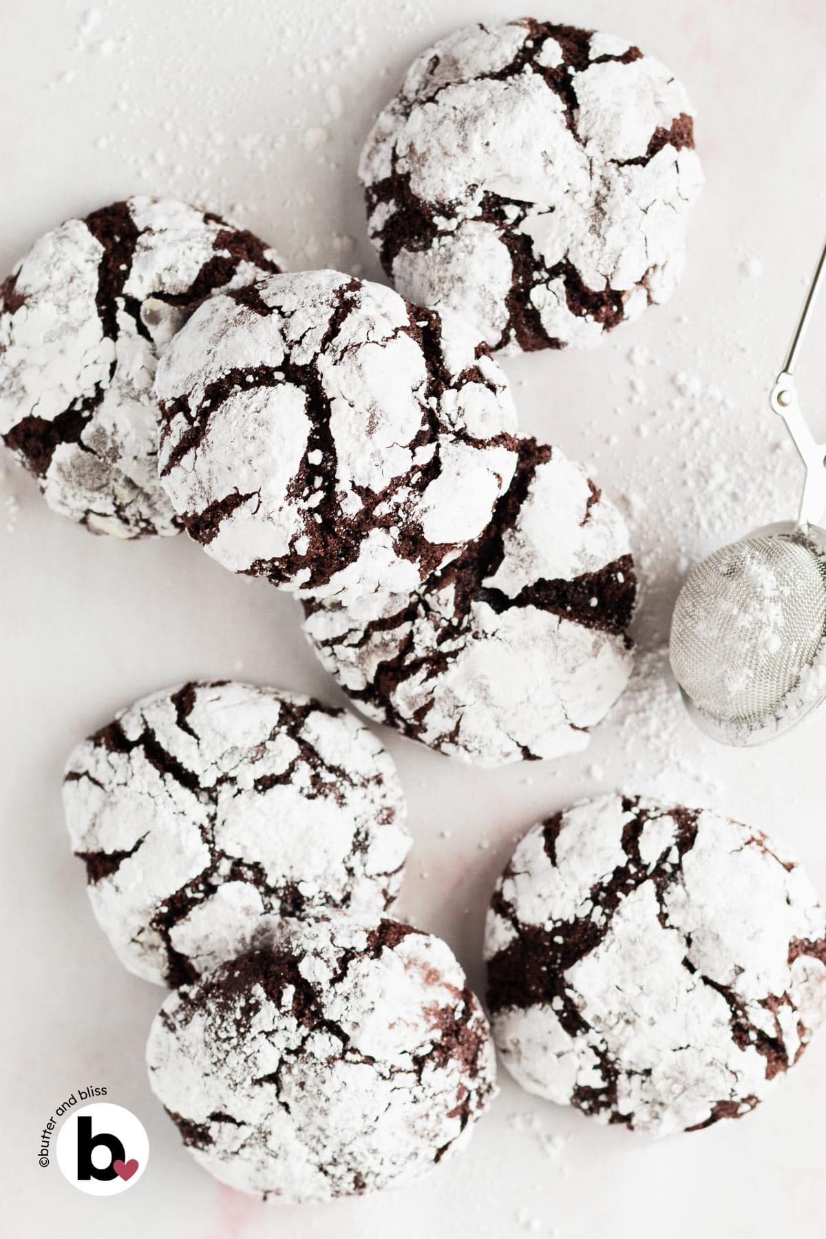 Small batch of fudgy chocolate crinkles arranged on a table.