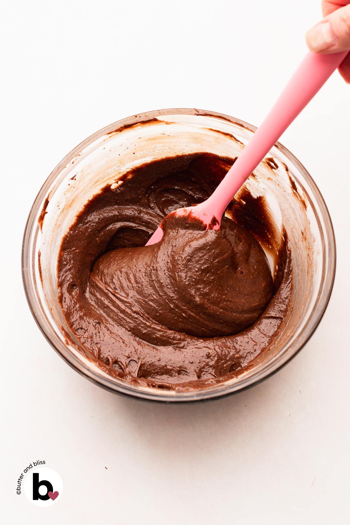 Thick brownie batter in a mixing bowl.