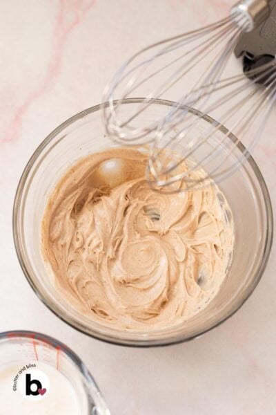 Whipped cream cheese in a mixing bowl, ready for heavy cream.