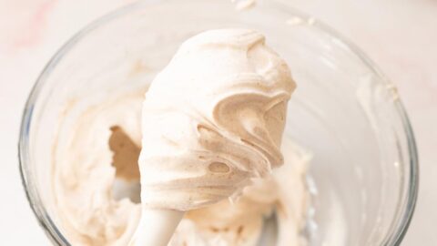 Fluffy maple cinnamon cream cheese frosting on a spatula.