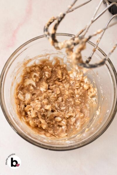 First step in mixing cream cheese and maple syrup in a bowl.