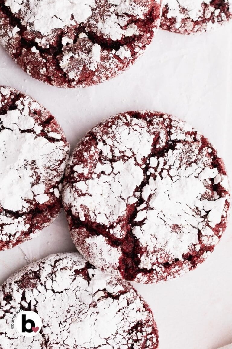 Pretty red velvet crinkle cookies close up, with powdered sugar crevices.