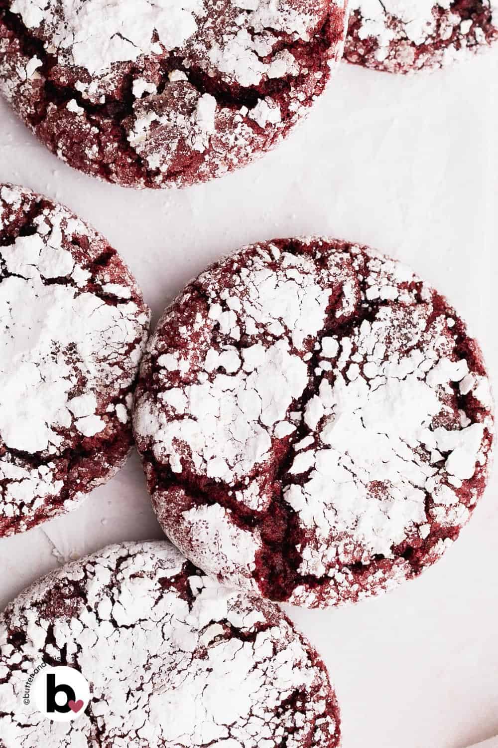 Pretty red velvet crinkle cookies close up, with powdered sugar crevices.