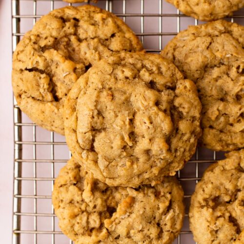 A stack of small batch chewy oatmeal cookies on a wire cooling rack.