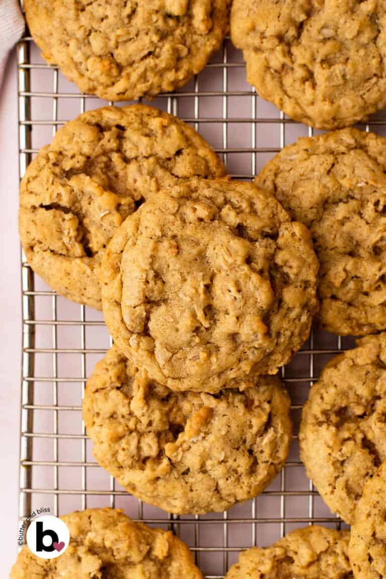 A stack of small batch chewy oatmeal cookies on a wire cooling rack.