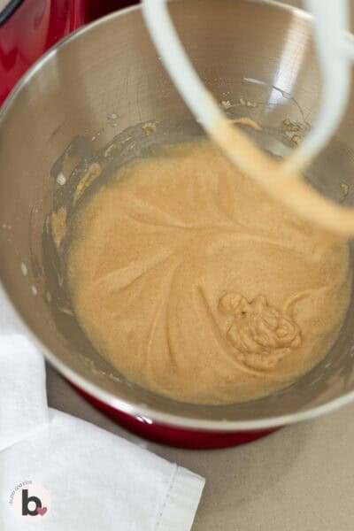 Snickerdoodle cupcake batter in a stand mixer bowl.