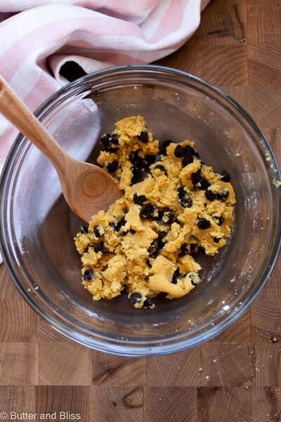 Chocolate chip cookie dough in a mixing bowl.