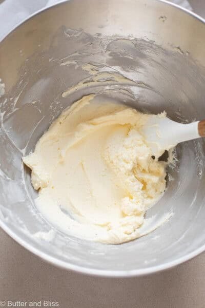 Creamed butter and cream cheese in a mixing bowl.
