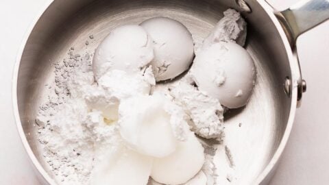 Coconut cream and coconut oil in a small saucepan to make frosting.