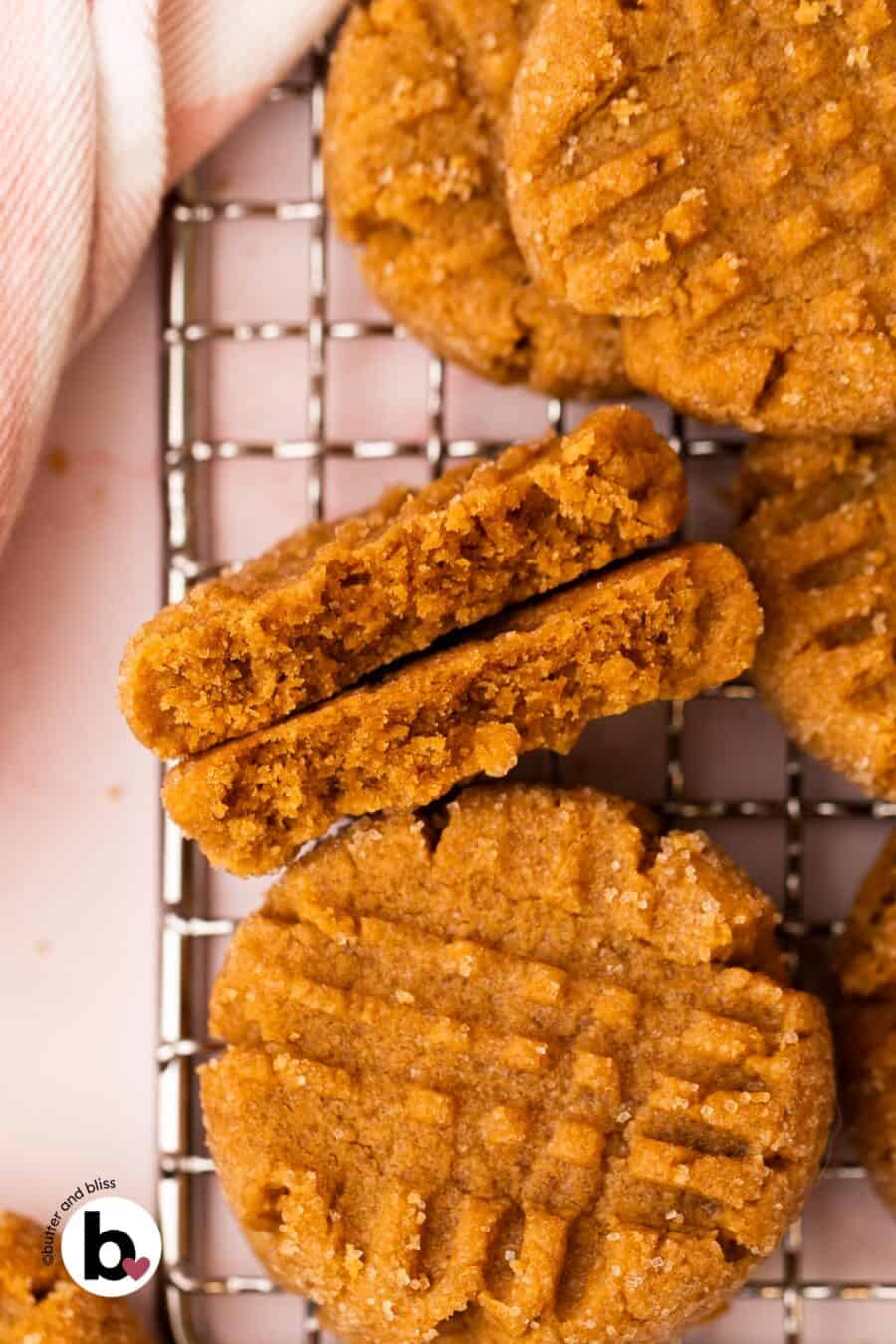 Thick peanut butter cookie cut in half to reveal the soft, chewy center.
