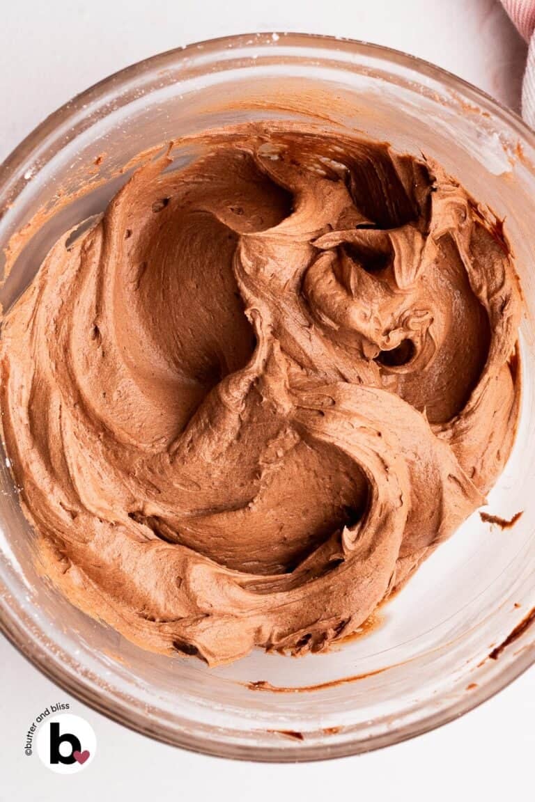 A mixing bowl full of peanut butter whipped chocolate ganache.