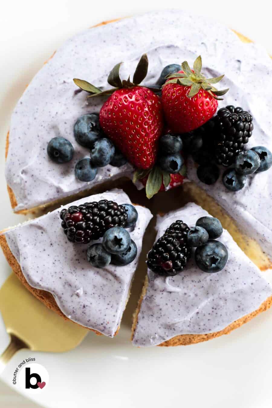 Small angel food cake cut into slices on a cake stand.