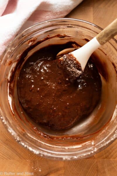 Thin chocolate cookie batter in a mixing bowl.