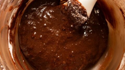 Thin chocolate cookie batter in a mixing bowl.