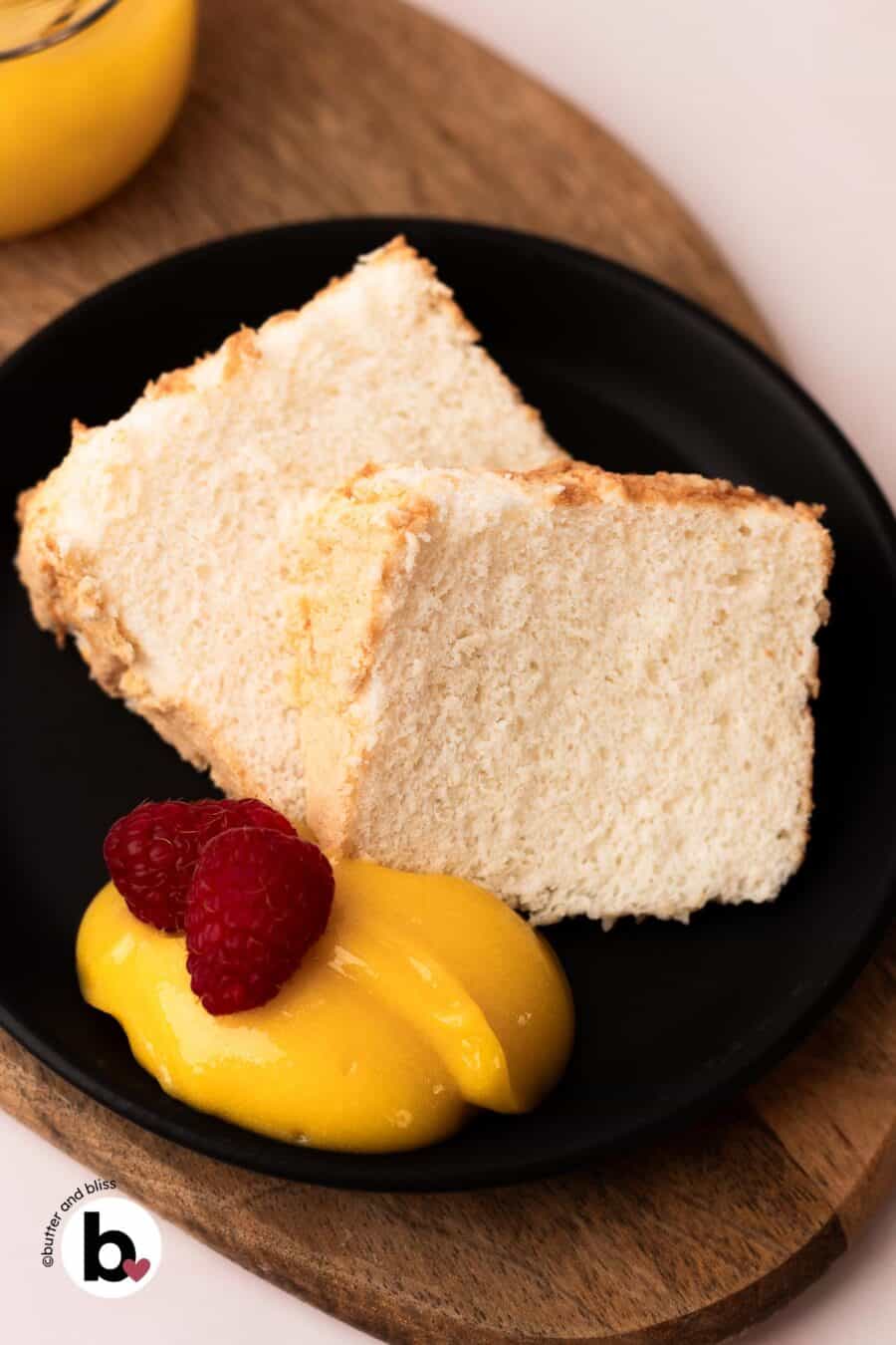 Lemon curd dollops with slices of pound cake on a plate.