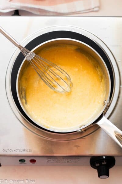 Sugar and egg yolks whisk until light in a small saucepan.